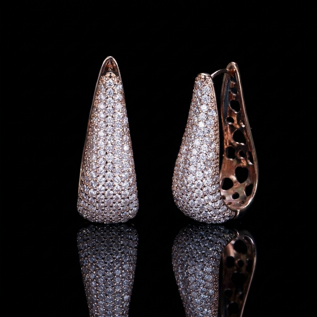 Luxurious rose gold tone hoop earrings adorned with brilliant zirconia stones in a minimalist, sophisticated design.