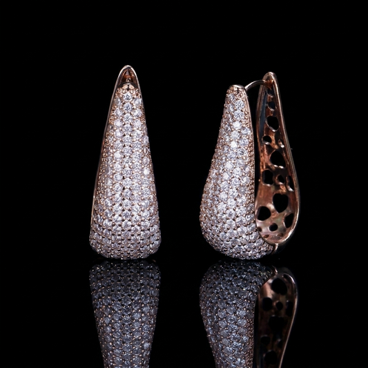 Luxurious rose gold tone hoop earrings adorned with brilliant zirconia stones in a minimalist, sophisticated design.
