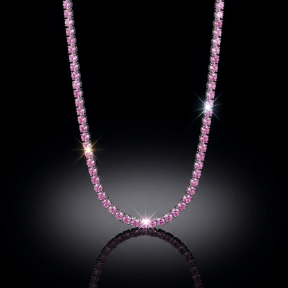 Luxury pink gemstone tennis necklace hanging in a symmetrical U-shape against a pitch-black background with dramatic lighting and a soft surface reflection.