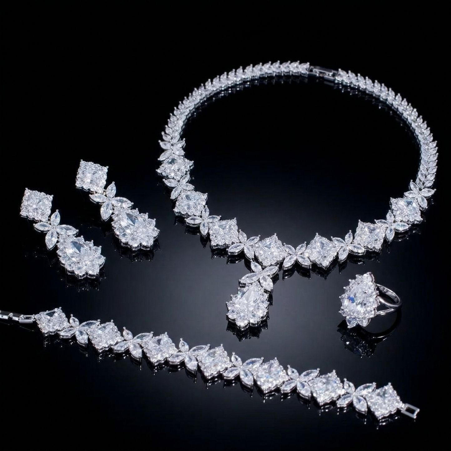 Luxurious statement jewelry set including a floral-inspired necklace, drop earrings, a matching bracelet, and a ring, all featuring brilliant marquise-cut white zircons.