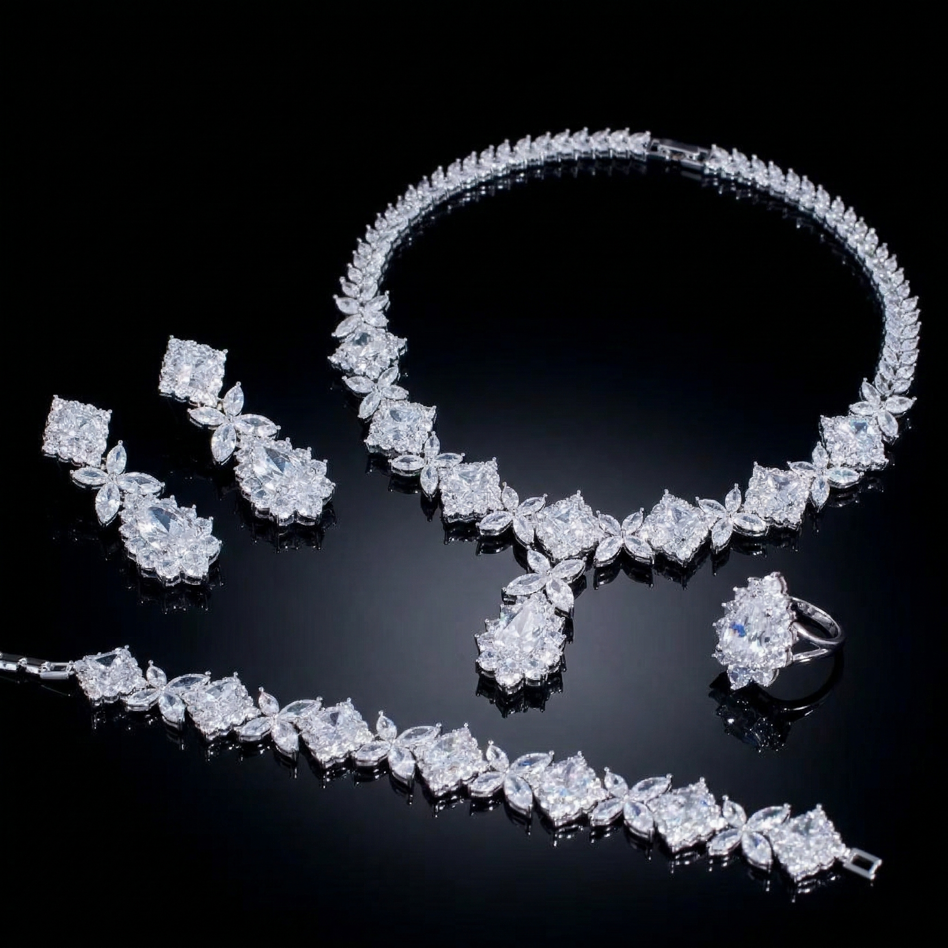 Luxurious statement jewelry set including a floral-inspired necklace, drop earrings, a matching bracelet, and a ring, all featuring brilliant marquise-cut white zircons.
