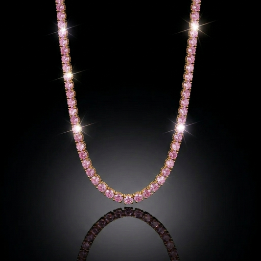 Luxury pink gemstone tennis necklace hanging in a symmetrical U-shape against a pitch-black background with dramatic lighting and a soft surface reflection.