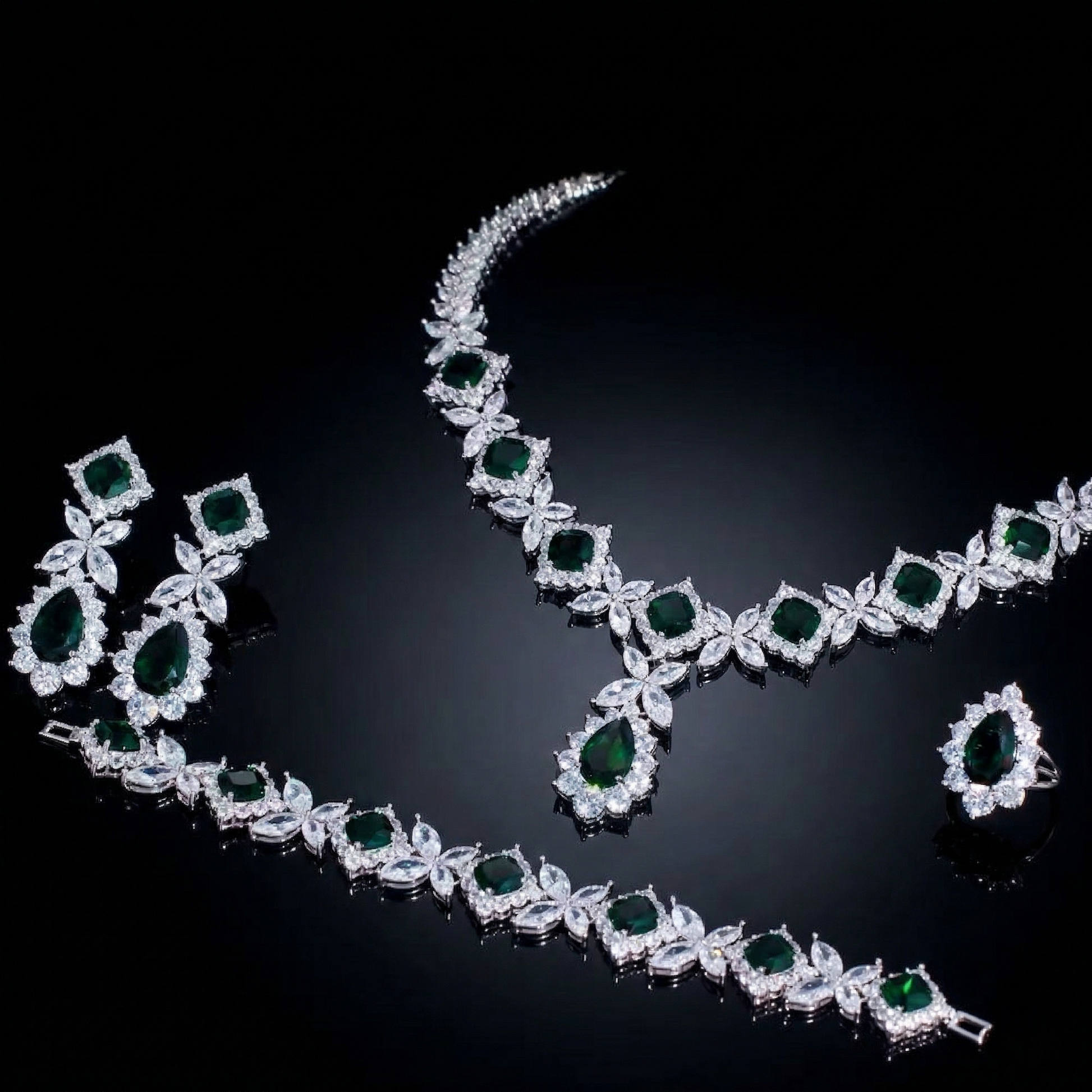Luxurious statement jewelry set including a floral-inspired necklace, drop earrings, a matching bracelet, and a ring, all featuring brilliant marquise-cut white zircons.